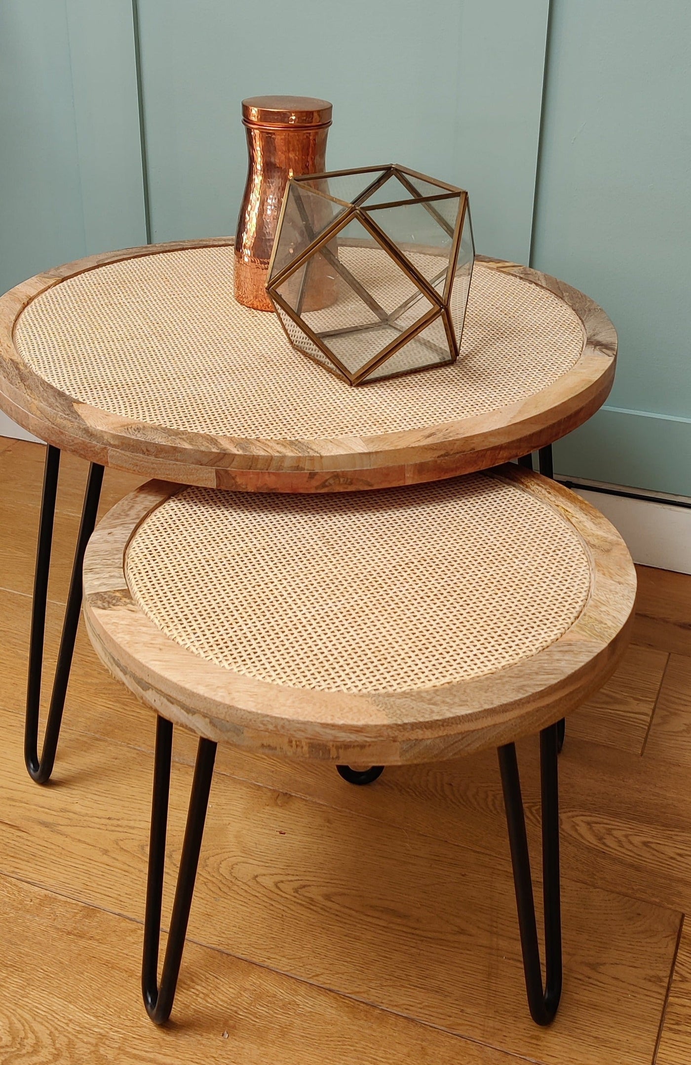 Round cane side table with rustic natural finish