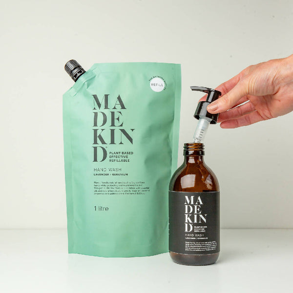 L & G 1 litre pouch with empty bottle with pump being held