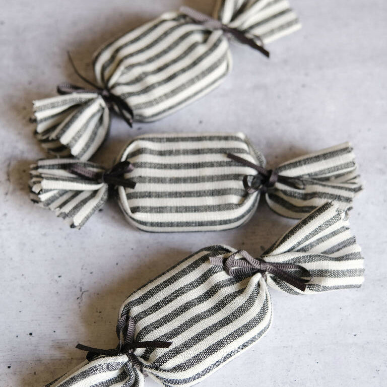 Three fabric wrapped tins to look like humbug sweets.