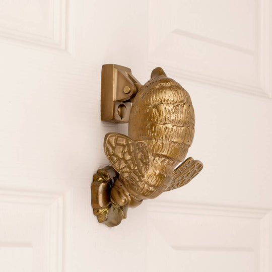 Cora Bee Door Knocker in Aged Brass