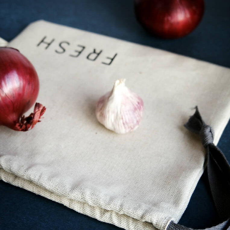 A linen produce bag for fresh foods such as garlic and onions