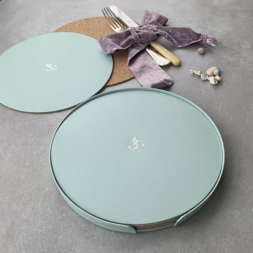 A Set of Six Recycled Leather Placemats with Bee Motif