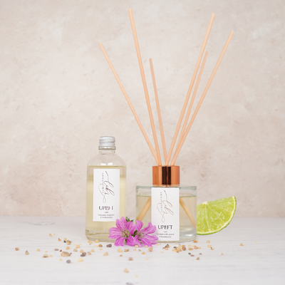 A diffuser duo with frankincense and geranium flowers