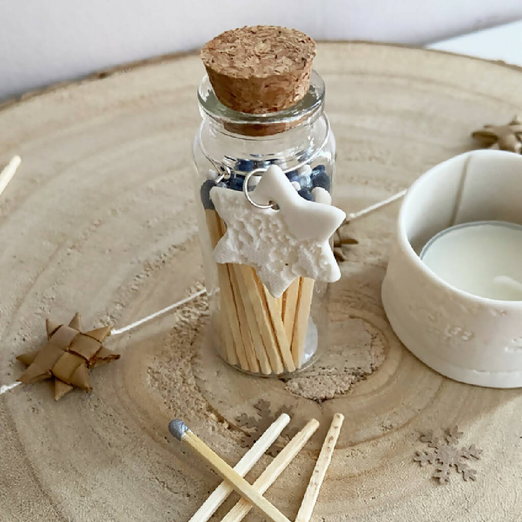 A Bottle Of Starry Night Matches And Porcelain Charm