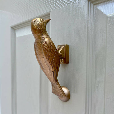 Cosima Woodpecker Door Knocker in Aged Brass