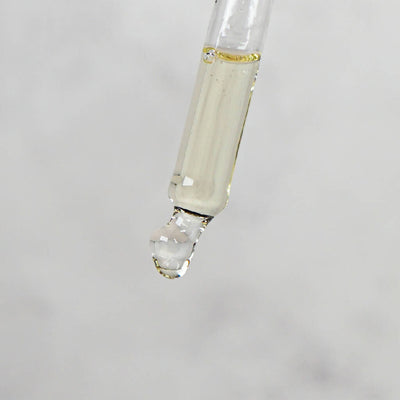 A glass pipette containing nail oil.jpg